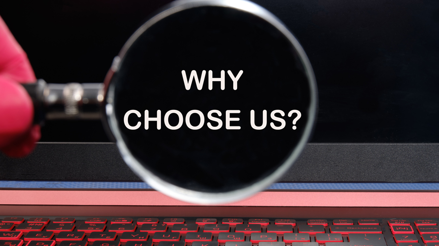 A keyboard with the text "Why Choose Us?" displayed prominently, emphasizing the benefits of selecting our services.